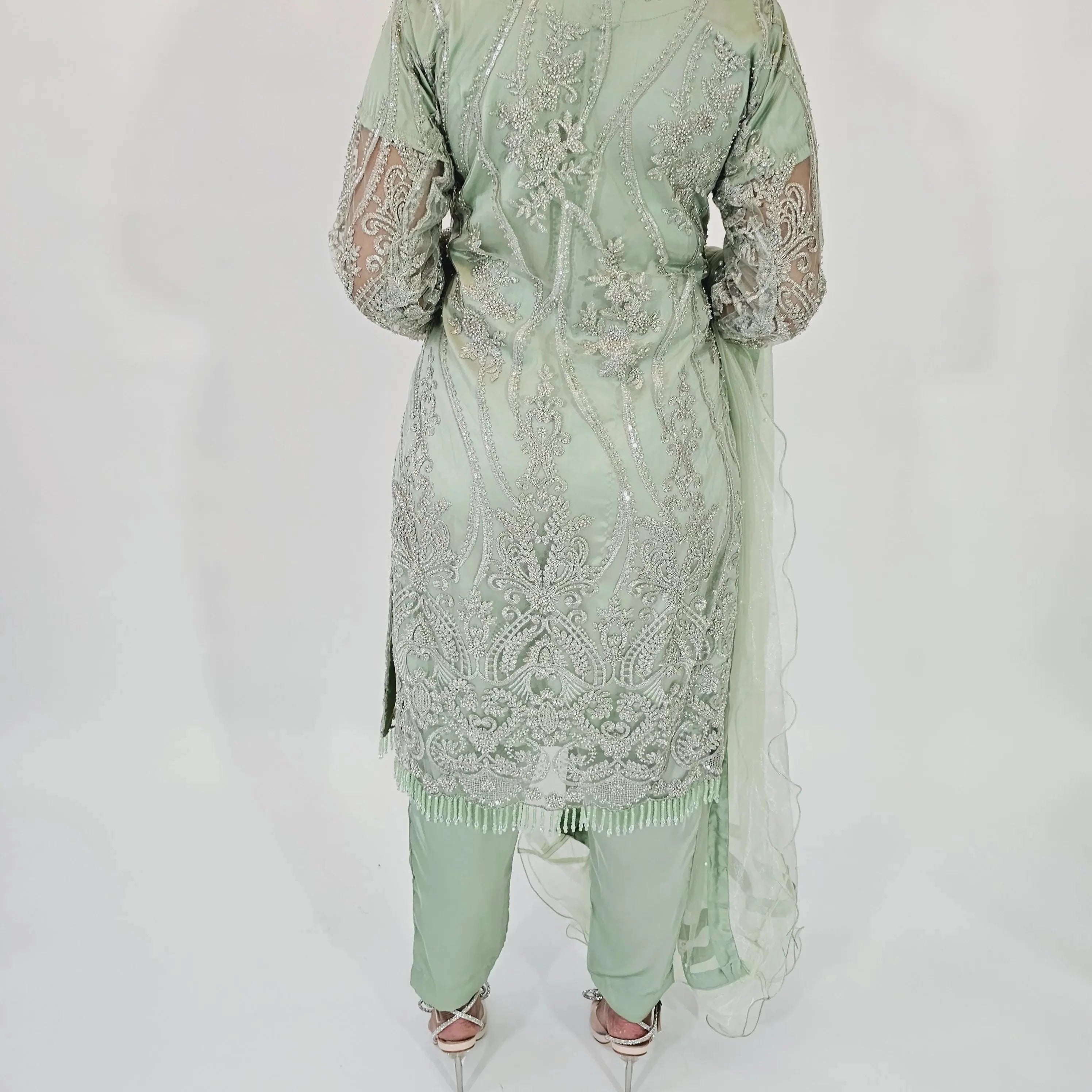 pista color three piece suit with net dupatta